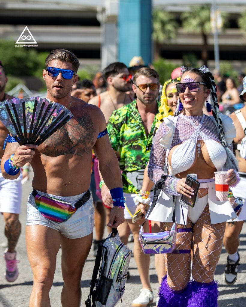 Excited festival-goers boarding the Live How You Want Shuttle, ready to dance the night away at EDC Las Vegas!